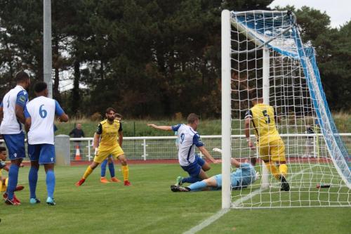 Horncurch keeper Calum Chafer blocks from Enfields Liam Hope
