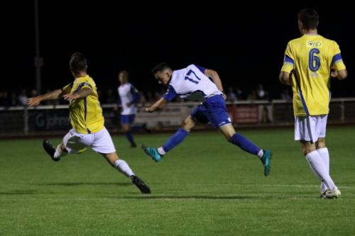 Enfields Brandon Adams lets fly from the edge of the box