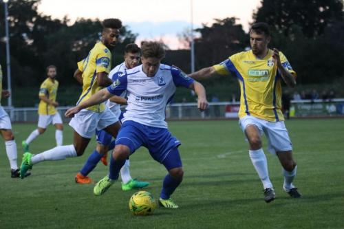 Enfields Lewis Taaffe breaks between Damien Green (L) and Sam Robbins, with Bilal Sayoud in support
