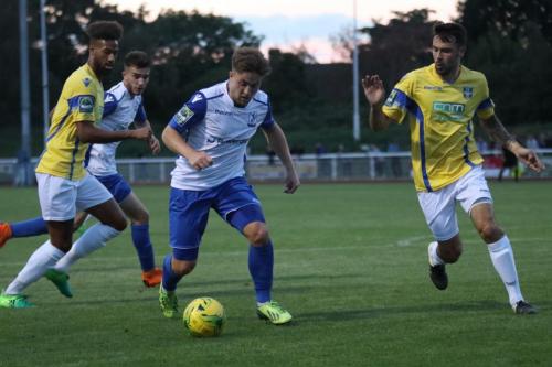 Enfields Lewis Taaffe breaks between Damien Green (L) and Sam Robbins, with Bilal Sayoud in supportx