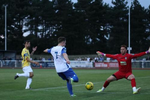 Enfields Lewis Taaffe draws the keeper before playing the ball back for Sam Youngs (out of shot) to make it 2-0