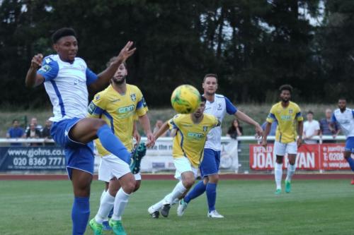 Enfields Rian McLean (L) stretches in vain for the ball