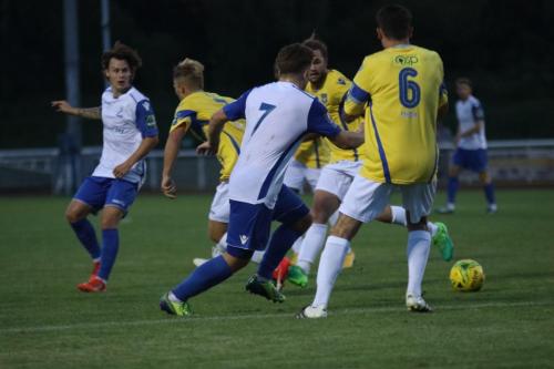 Enfields Sam Chaney (L) tries to thread a pass to Lewis Taaffe (7)
