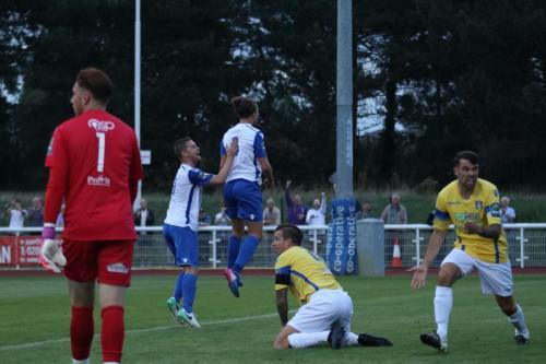 Scorer Sam Youngs (white, R) celebrates the second Enfield goal with Liam Hope