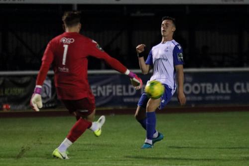 Stortford keeper Calum Kitscha clears from Brandon Adams