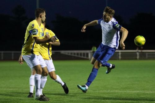 Stortfords Sam Robbins (L) and Lewis Dark and Enfields Lewis Taaffe