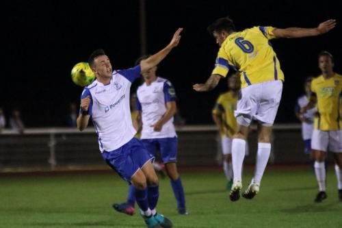 Stortfords Sam Robbins (R) wins a header against Brandon Adams