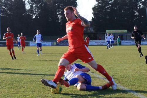 Enfields Sam Chaney (white) challenges Finn OMara