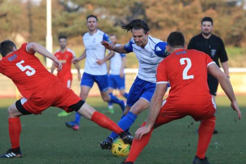 Enfields Sam Youngs and Folkestones Callum Davies (L) and Josh Vincent