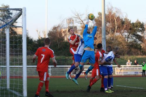 Folkestone keeper Tim Roberts collects a cross