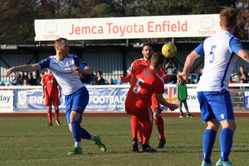 Folkestones Callum Davies (5) blocks a shot from Sam Hatton (L)