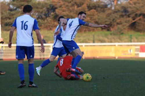 Folkestones Michael Everitt (red) challenges Matt Johnsonx