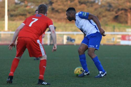 Folkestones Scott Heard (L) and Enfields Kezie ibe