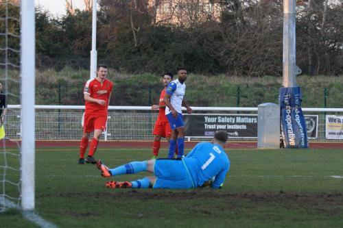 Folkestones Tim Roberts saves a sciuffed shot from Kezie ibe