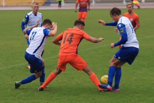 Enfields Bilal Sayoud (L) and Sam youngs challenge Harley Haag