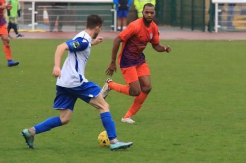 Enfields Bilal Sayoud runs at Junior Brown