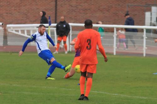 Enfields Billy Bricknell sees hos shot blocked by a Ware defender