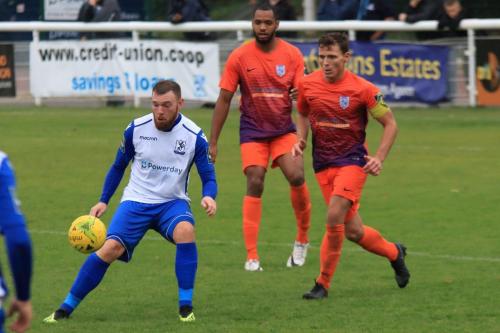 Enfields Billy Bricknell watched by Bradley Madden (R) and Junior Brown