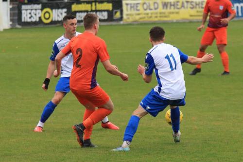 Enfields Brandon Adams (L) and Bilal Sayoud and Wares Billy Baird