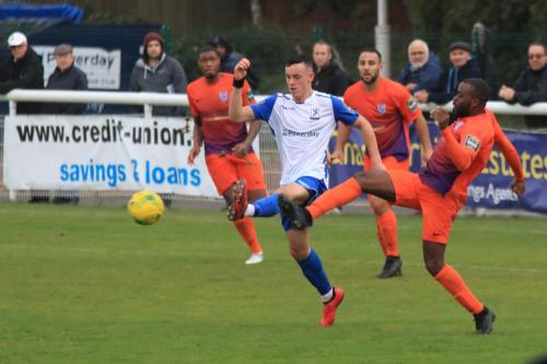 Enfields Brandon Adams (L) and Wares Dom Njoya