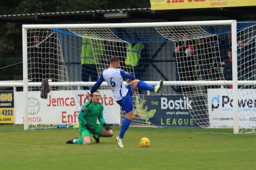 Enfields Dan Rumens (6) slices a clearance as Joe Wright waits for the ball