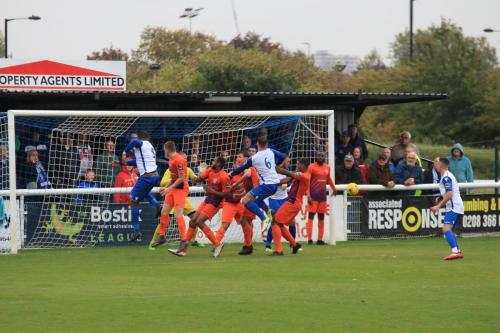 Enfields Taofiq Olomowewe (L) and Dan Rumens fail to make contact at a corner kick