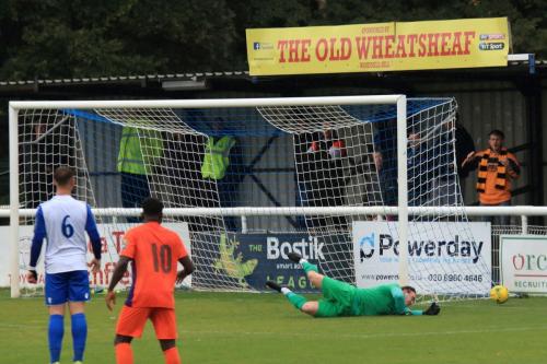Enfields keeper Joe Wright turns a shot away for a corner