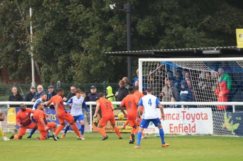 The Ware defence scrambles a shot to safety