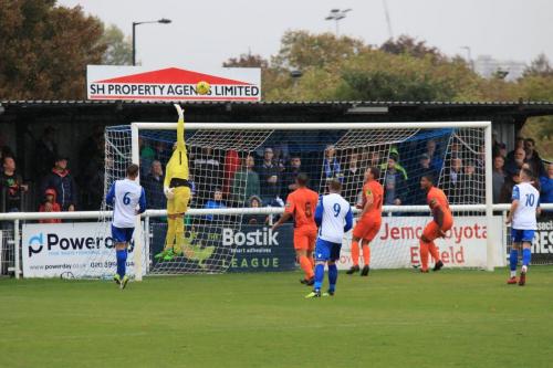 Ware keeepr Harry Ricketts covers the crossbar as a cross shot dips too late