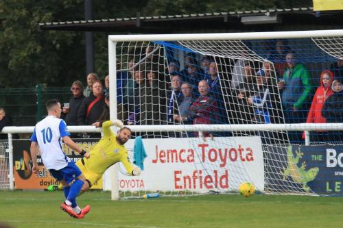 Ware keeper Harry Ricketts is beaten but the ball hits the far post