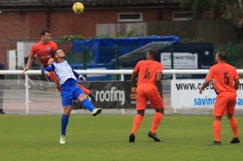 Wares Gareth Madden (L) beats Dan Rumens and gets his header on goal