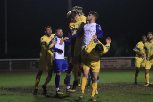 Enfields Dan Rumens (white, R) has a handful of Jack Thomass shirt while Sam Robbins (L) holds onto Billy Bricknell