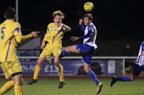 Enfields Matt Johnson  (R) wins a header against Alfie Mason