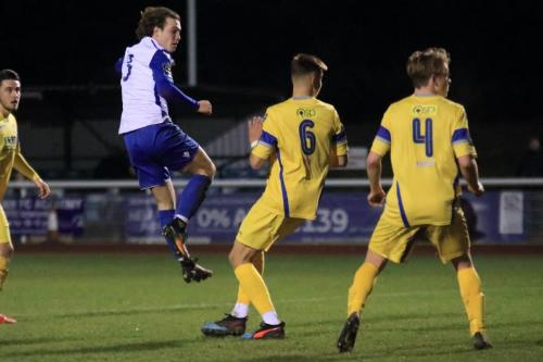 Enfields Mickey Parcell (white) shoots over the bar