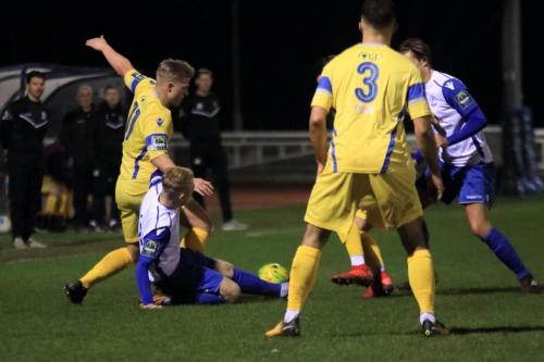 Enfields Ryan Blackman (white, L) challenges Alfie Mason