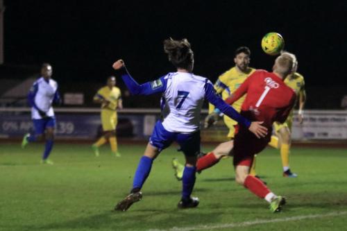 Enfields Sam Youngs lifts the ball over keeper Arthur Janata but the ball is cleared off the line
