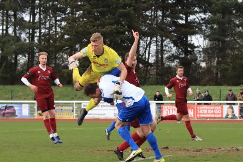 Bognor keeper Petar Durin challenges Matt Johnson