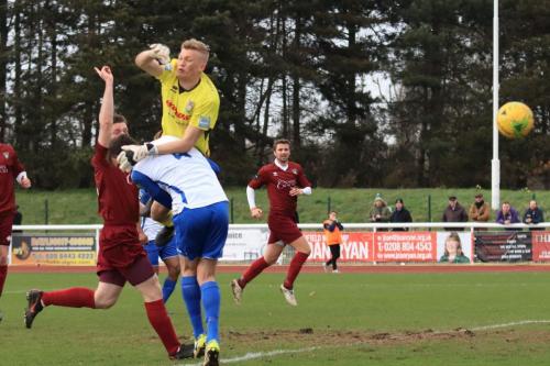 Bognor keeper Petar Durin challenges Matt Johnsonx