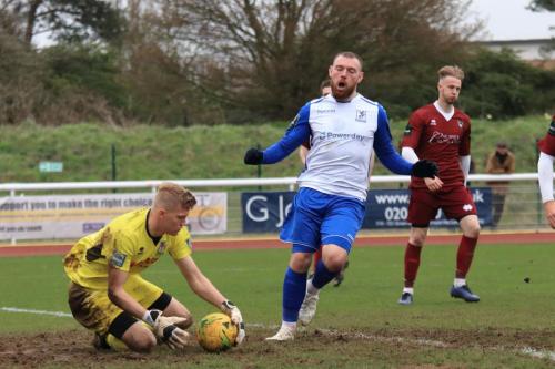 Bognor keeper Petar Durin makes sure the ball doesnt run loose to Billy Bricknell