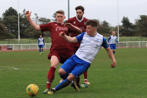 Bognors Chad Field (L) challenges Jay Porter