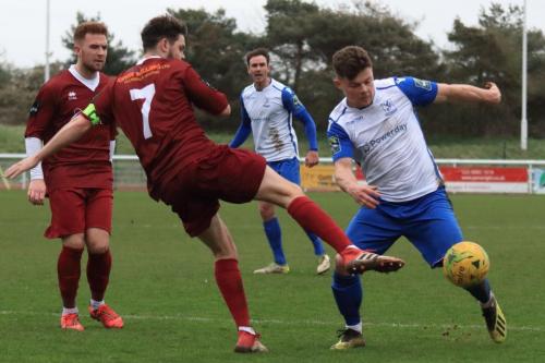 Bognors Harvey Whyte (7) challenges Jay Porter