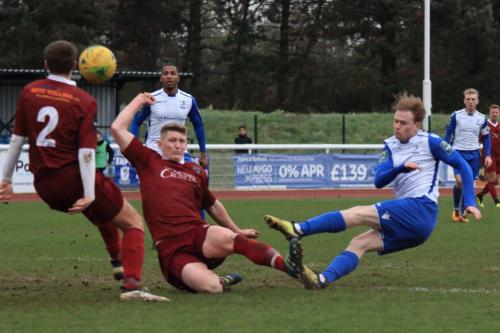 Enfields Aaron Greene (R) scuffs an attempted shot under challenge from Chad Field