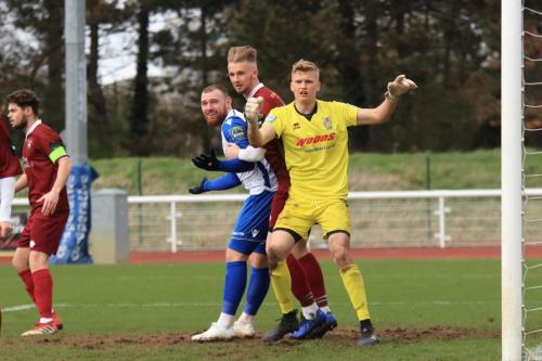 Enfields Billy Bricknell (white) and Bognors Harvey Read and keeper Petar Durin jostle for position at a corner
