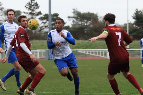Enfields James Mulley bursts between Ed Sanders and Harvey Whyte (7)