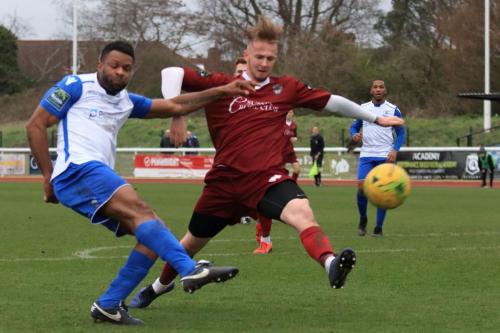 Enfields Kezie Ibe shoots as Harvey Read tries to block