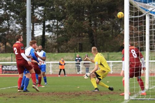 Enfields Marc Weatherstone (white, L) heads just off target