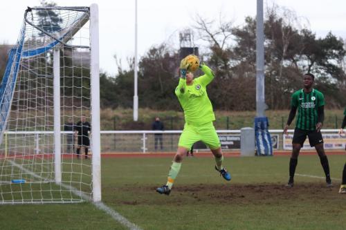 Burgess Hill keeper Josh James saves from Sam Hattons header