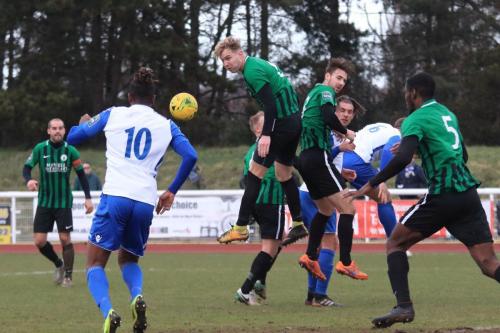 Burgess Hills James Richmond (3rd L) wins a header