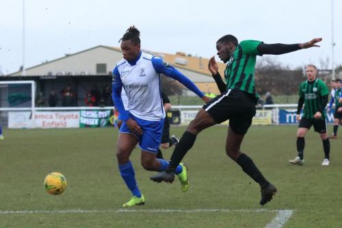 Burgess Hills Tolulope Jonah (R) clears from Karl Oliyide