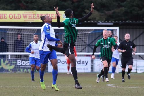 Burgess Hills Tolulope Jonah (R) heads clear from Karl Oliyide